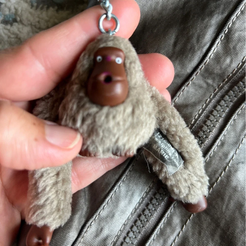 Kipling Angela medium shoulder bag Stylish Metallic with furry monkey Mary